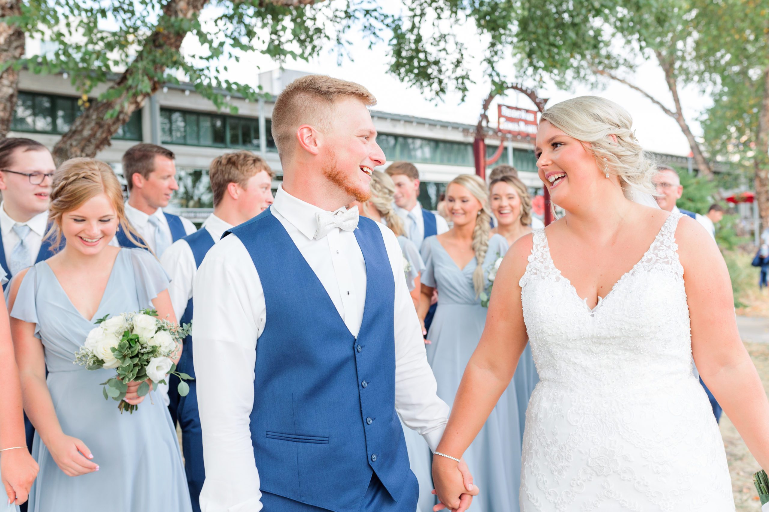 Bride and groom walk with bridal party